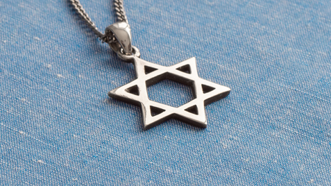 Photo of a Star of David on blue fabric