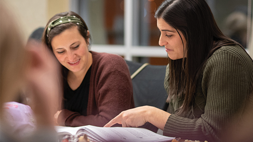 Two women reading in a Melton KC class